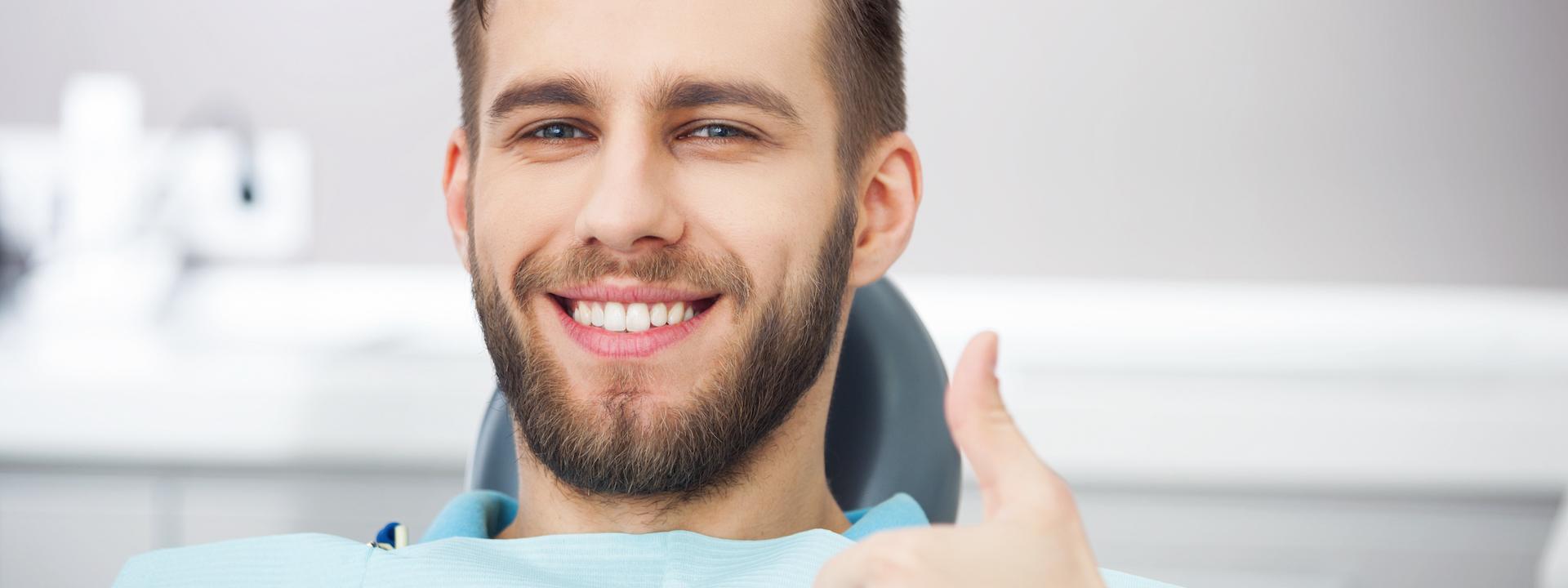 man-smiling-dental-chair